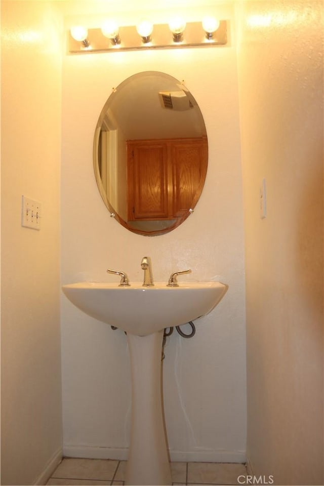 1044 Turner Ave Unit 207, Ontario, CA 91764 - bathroom featuring tile patterned flooring, baseboards, and a sink