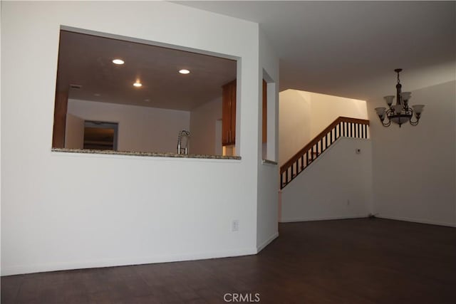 1044 Turner Ave Unit 207, Ontario, CA 91764 - empty room featuring a chandelier, wood finished floors, recessed lighting, baseboards, and stairs