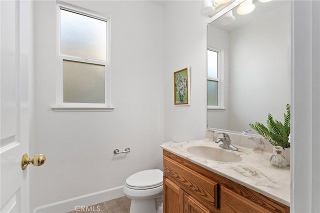 121 Wawona Pl, Chico, CA 95928 - half bath with vanity, toilet, tile patterned floors, and baseboards