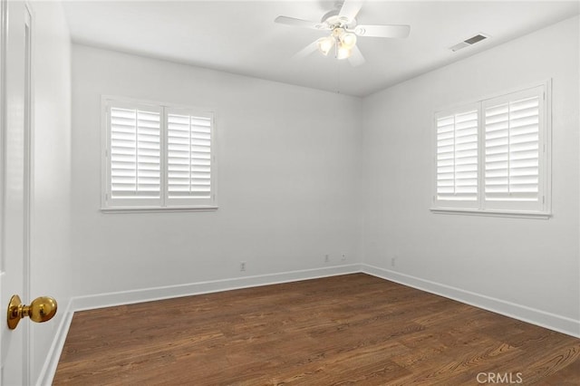 121 Wawona Pl, Chico, CA 95928 - unfurnished room featuring dark wood-type flooring, baseboards, healthy amount of natural light, and a ceiling fan
