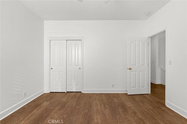 121 Wawona Pl, Chico, CA 95928 - unfurnished bedroom with baseboards, dark wood-style floors, and a closet