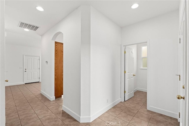 121 Wawona Pl, Chico, CA 95928 - corridor with light tile patterned floors, arched walkways, recessed lighting, and baseboards