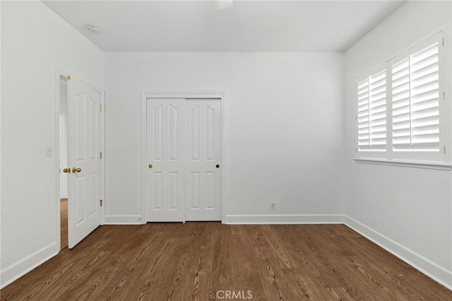 121 Wawona Pl, Chico, CA 95928 - unfurnished bedroom with wood finished floors, baseboards, and a closet
