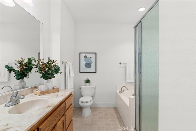 121 Wawona Pl, Chico, CA 95928 - bathroom featuring baseboards, a garden tub, vanity, toilet, and a shower stall