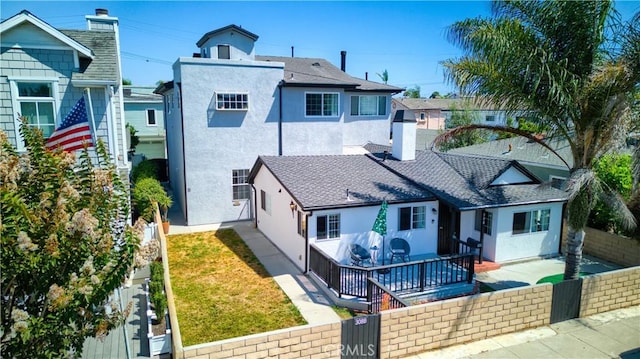 308 13th St, Seal Beach, CA 90740 - view of front facade with stucco siding, a fenced backyard, a gate, and a patio