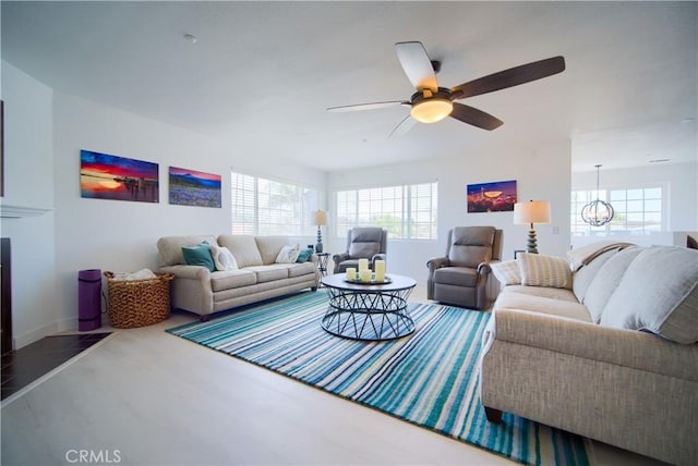 308 13th St, Seal Beach, CA 90740 - living area featuring plenty of natural light, ceiling fan, wood finished floors, and baseboards