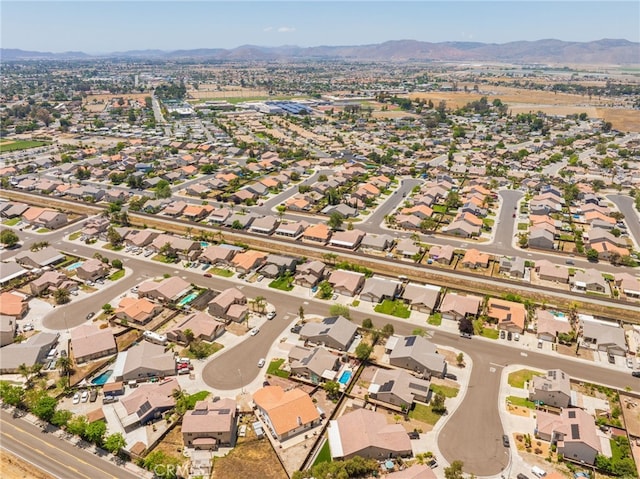 126 Schooner Ct, San Jacinto, CA 92583 - aerial view of property's location featuring a mountain backdrop and nearby suburban area