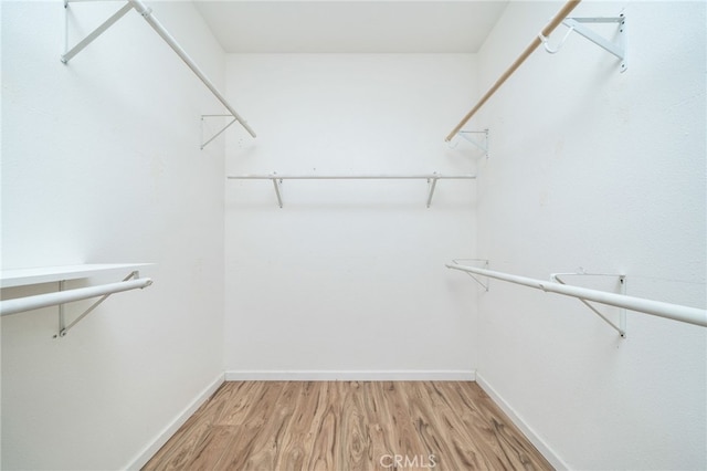 126 Schooner Ct, San Jacinto, CA 92583 - walk in closet featuring light wood-type flooring