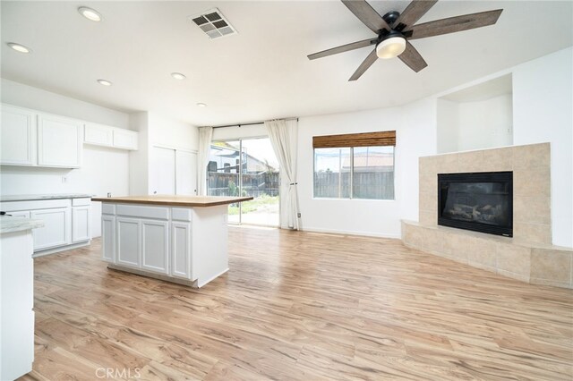 126 Schooner Ct, San Jacinto, CA 92583 - kitchen featuring open floor plan, light wood-style flooring, white cabinetry, recessed lighting, and ceiling fan