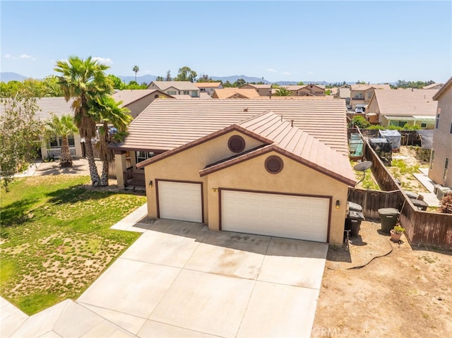 126 Schooner Ct, San Jacinto, CA 92583 - view of front of home with a garage, concrete driveway, a residential view, stucco siding, and a tile roof