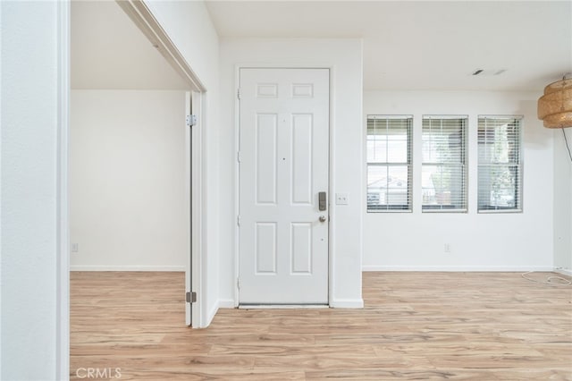 126 Schooner Ct, San Jacinto, CA 92583 - foyer featuring light wood finished floors and baseboards