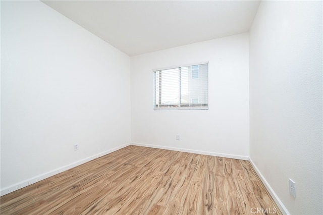 126 Schooner Ct, San Jacinto, CA 92583 - empty room with light wood finished floors and baseboards