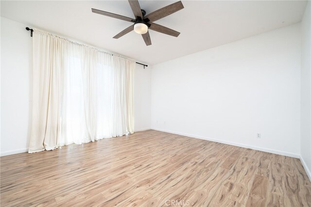 126 Schooner Ct, San Jacinto, CA 92583 - spare room with a ceiling fan, light wood finished floors, and baseboards