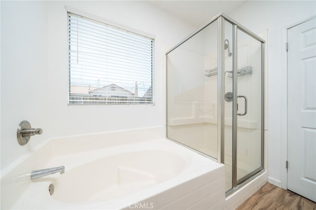 126 Schooner Ct, San Jacinto, CA 92583 - bathroom with a stall shower, a bath, and wood finished floors