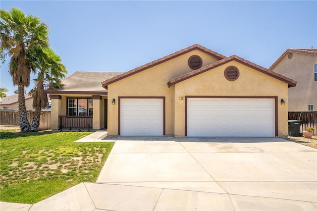 126 Schooner Ct, San Jacinto, CA 92583 - view of front of home with an attached garage, driveway, stucco siding, and a tiled roof