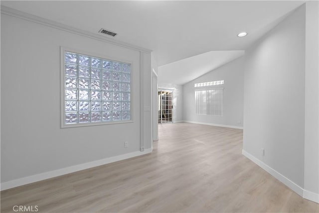 unfurnished room with baseboards, light wood finished floors, lofted ceiling, and recessed lighting