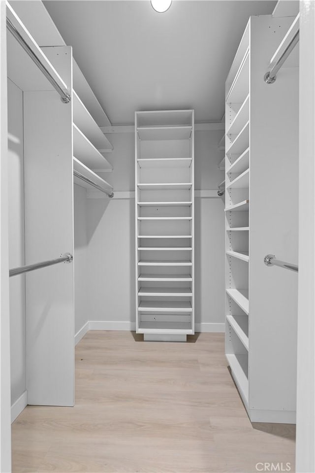 spacious closet with wood finished floors