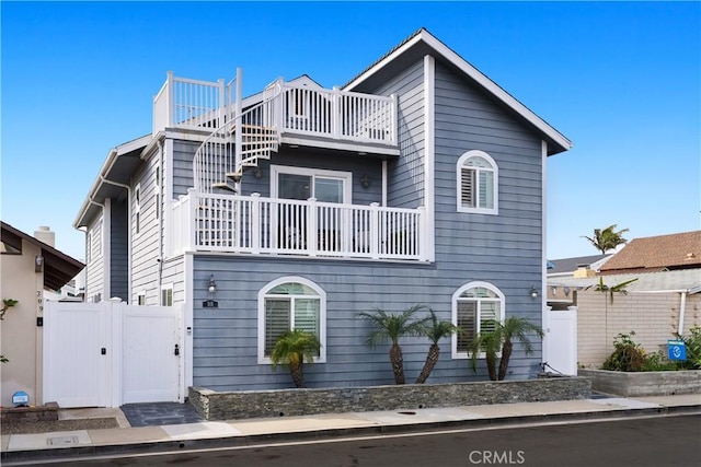 315 Lugonia St, Newport Beach, CA 92663 - multi unit property with a balcony, a gate, and fence