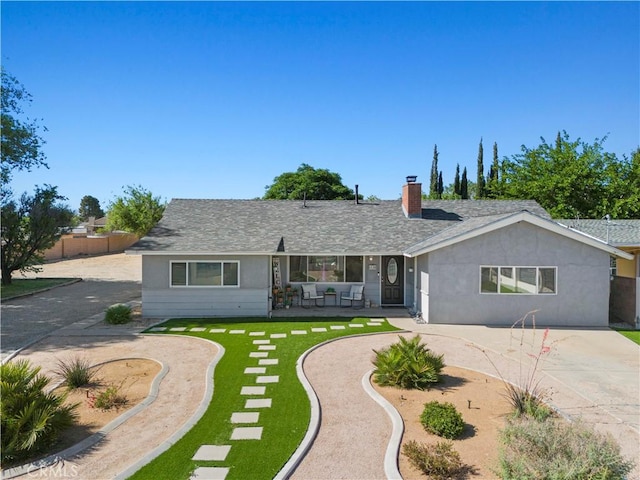5136 W W Ave L8, Lancaster, CA 93536 - single story home featuring a chimney, curved driveway, stucco siding, and roof with shingles