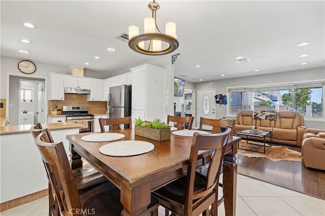 5136 W W Ave L8, Lancaster, CA 93536 - dining area featuring light tile patterned flooring, recessed lighting, and a chandelier