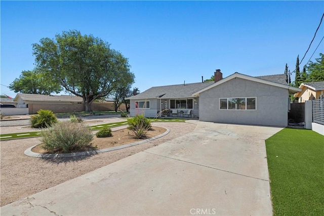 5136 W W Ave L8, Lancaster, CA 93536 - single story home with driveway, a chimney, and stucco siding
