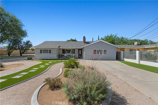 5136 W W Ave L8, Lancaster, CA 93536 - ranch-style house with concrete driveway, a chimney, and stucco siding