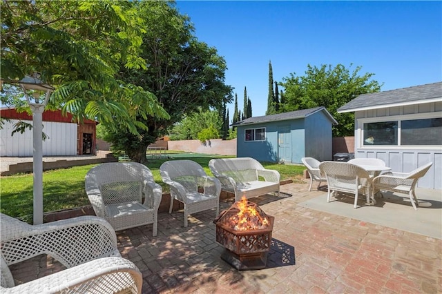 5136 W W Ave L8, Lancaster, CA 93536 - view of patio / terrace with a fire pit and outdoor dining area