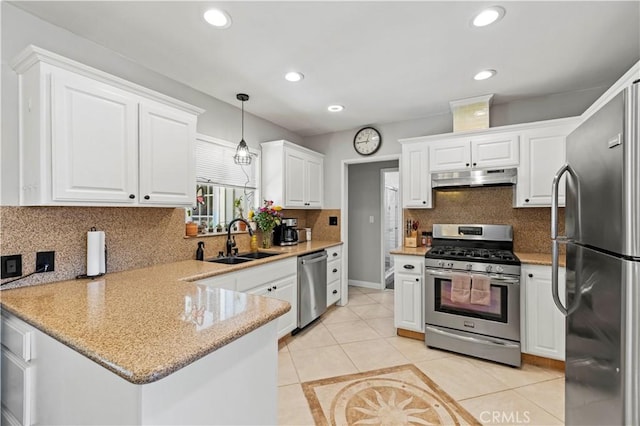 5136 W W Ave L8, Lancaster, CA 93536 - kitchen with stainless steel appliances, a sink, under cabinet range hood, a peninsula, and white cabinets