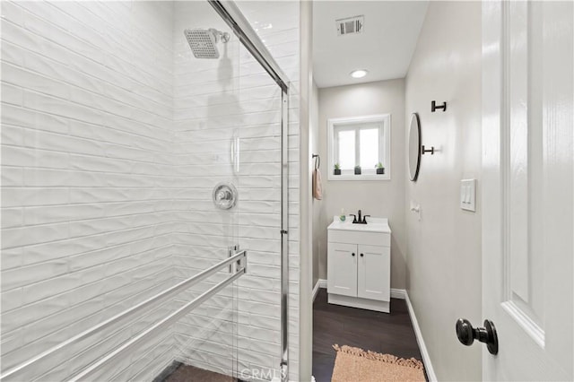 5136 W W Ave L8, Lancaster, CA 93536 - full bath featuring tiled shower, vanity, wood finished floors, and baseboards