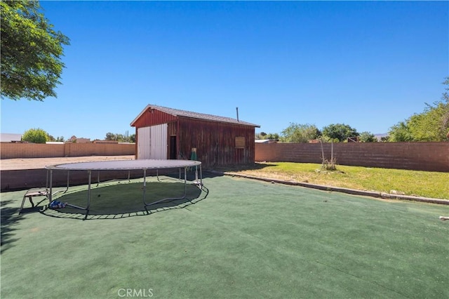 5136 W W Ave L8, Lancaster, CA 93536 - fenced backyard featuring a trampoline