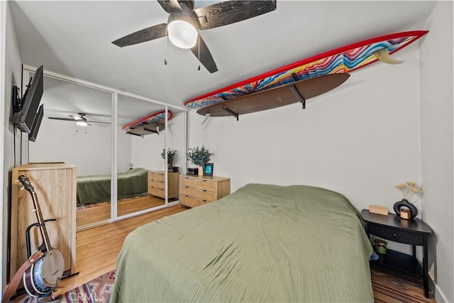 bedroom featuring wood finished floors and ceiling fan