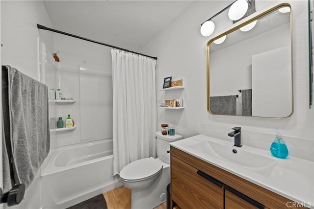 bathroom with toilet, vanity, shower / bath combo with shower curtain, and wood finished floors