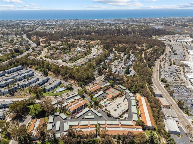 aerial view of property and surrounding area with nearby suburban area