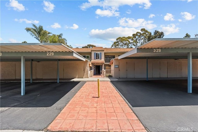 view of front of property with covered parking