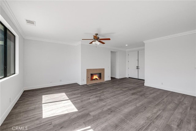 47432 Bahama Ct, Indio, CA 92201 - unfurnished living room with wood finished floors, ceiling fan, a tiled fireplace, baseboards, and crown molding