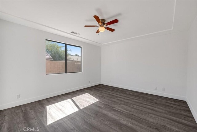 47432 Bahama Ct, Indio, CA 92201 - spare room featuring a ceiling fan, dark wood finished floors, and baseboards