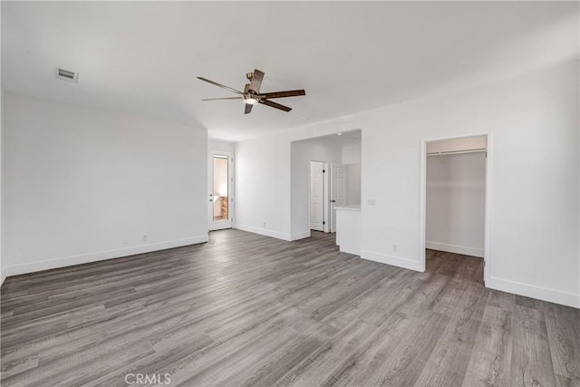 47432 Bahama Ct, Indio, CA 92201 - unfurnished living room featuring a ceiling fan, wood finished floors, and baseboards