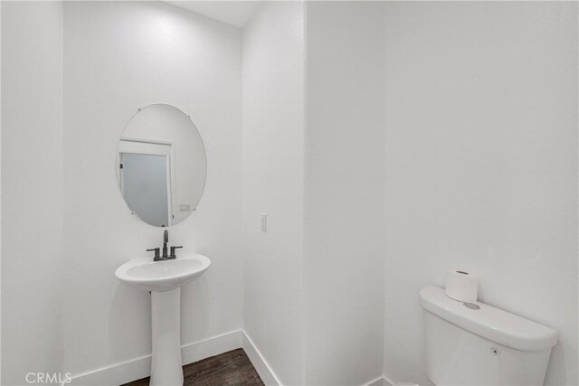 47432 Bahama Ct, Indio, CA 92201 - bathroom with baseboards, wood finished floors, and toilet