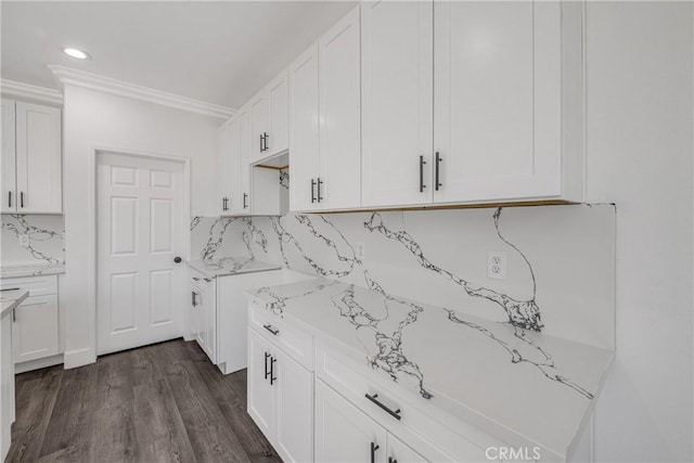 47432 Bahama Ct, Indio, CA 92201 - kitchen featuring ornamental molding, tasteful backsplash, white cabinetry, dark wood finished floors, and recessed lighting