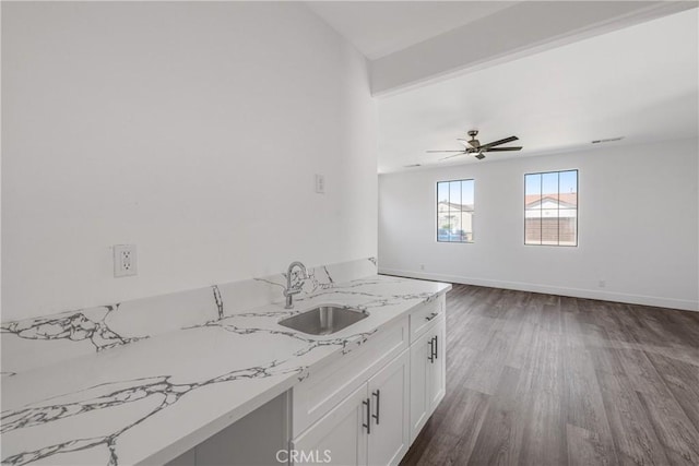 47432 Bahama Ct, Indio, CA 92201 - kitchen featuring a sink, dark wood-style flooring, white cabinets, light stone counters, and a ceiling fan