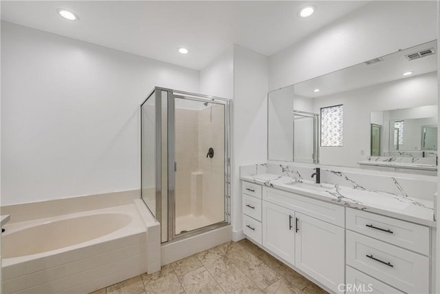47432 Bahama Ct, Indio, CA 92201 - bathroom featuring a shower stall, a garden tub, vanity, and recessed lighting