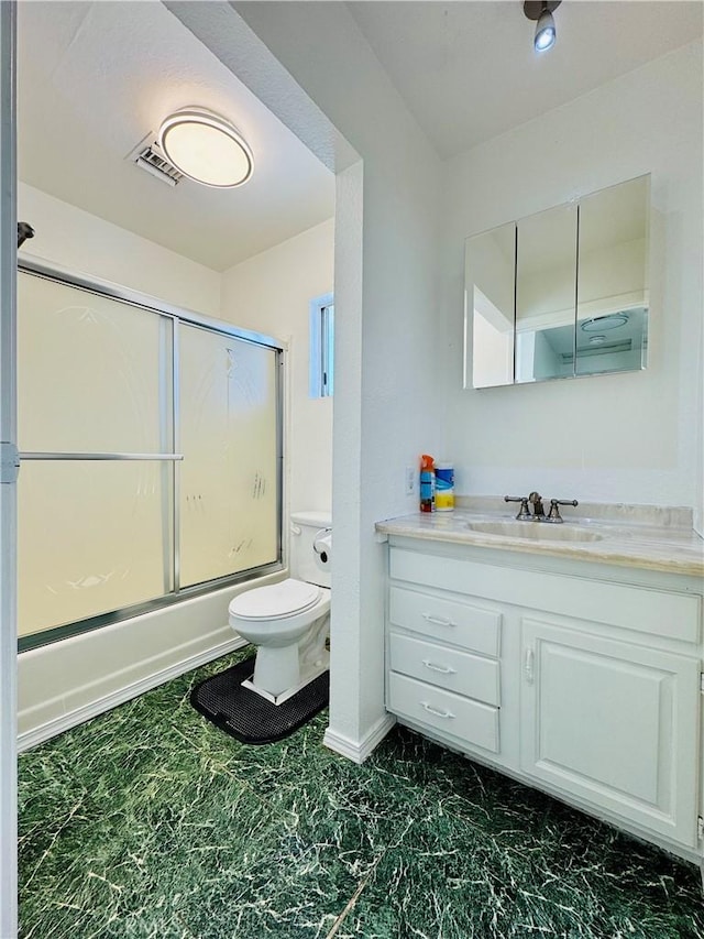 7019 Chimineas Ave, Reseda, CA 91335 - bathroom featuring vanity, toilet, shower / bath combination with glass door, and baseboards