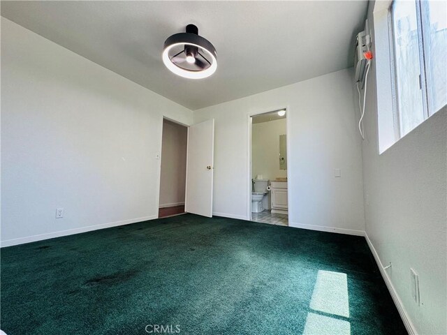 7019 Chimineas Ave, Reseda, CA 91335 - unfurnished bedroom featuring carpet flooring, baseboards, and connected bathroom