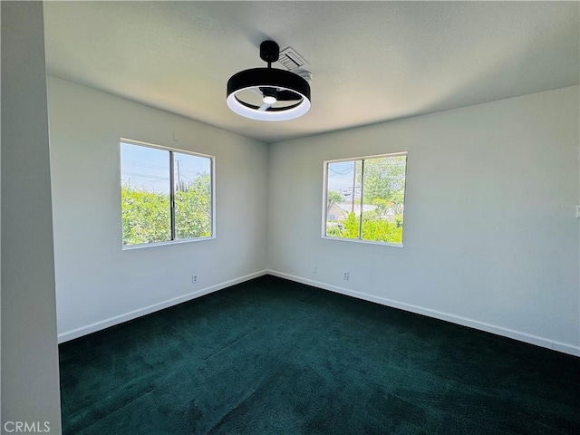 7019 Chimineas Ave, Reseda, CA 91335 - unfurnished room with baseboards, healthy amount of natural light, and dark colored carpet