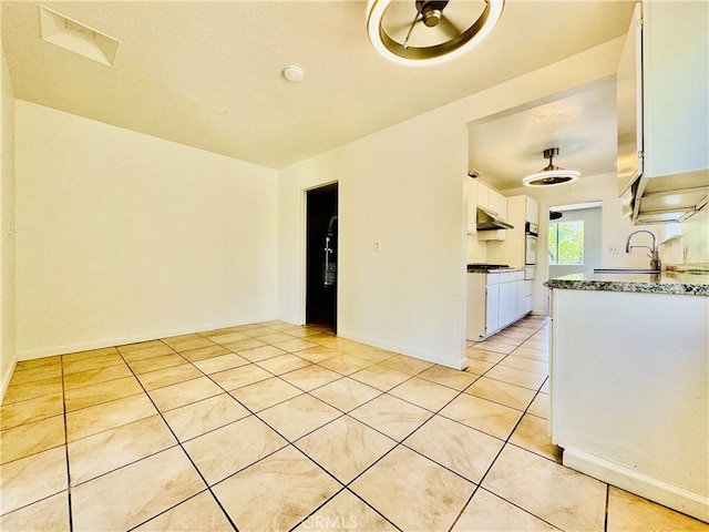 7019 Chimineas Ave, Reseda, CA 91335 - spare room featuring light tile patterned floors, a sink, a smoke detector, and baseboards