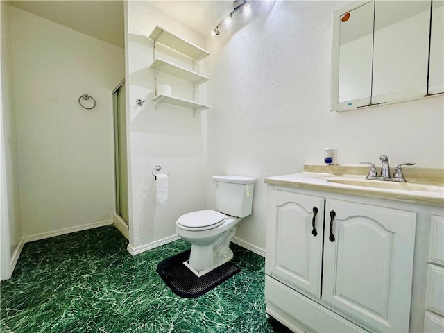 7019 Chimineas Ave, Reseda, CA 91335 - bathroom featuring a stall shower, toilet, vanity, and baseboards