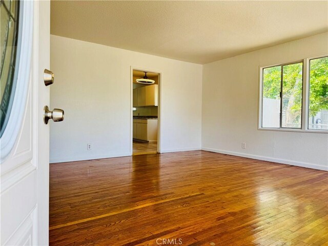 7019 Chimineas Ave, Reseda, CA 91335 - unfurnished room with hardwood / wood-style floors and baseboards