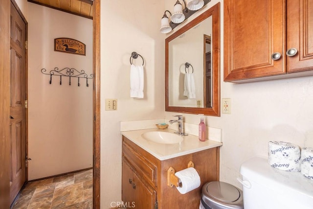 2032 Cedar Pine Ln, Big Bear City, CA 92314 - bathroom with toilet, vanity, and stone finish flooring