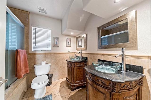 1704 Pass And Covina Rd, West Covina, CA 91792 - full bath with tile walls, an enclosed shower, toilet, tile patterned flooring, and a wainscoted wall