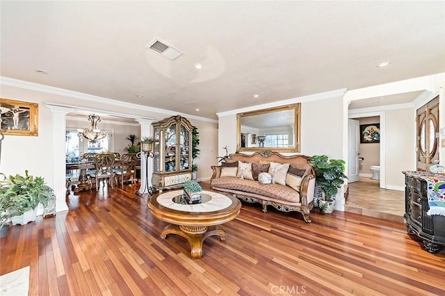 1704 Pass And Covina Rd, West Covina, CA 91792 - living room featuring decorative columns, light wood-style flooring, baseboards, healthy amount of natural light, and ornamental molding